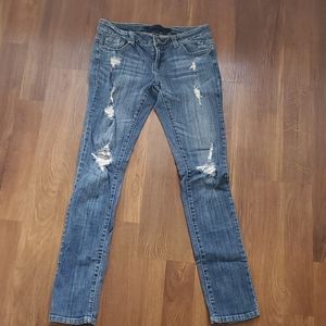 Size 7 long. destructed skinny jean. Medium wash